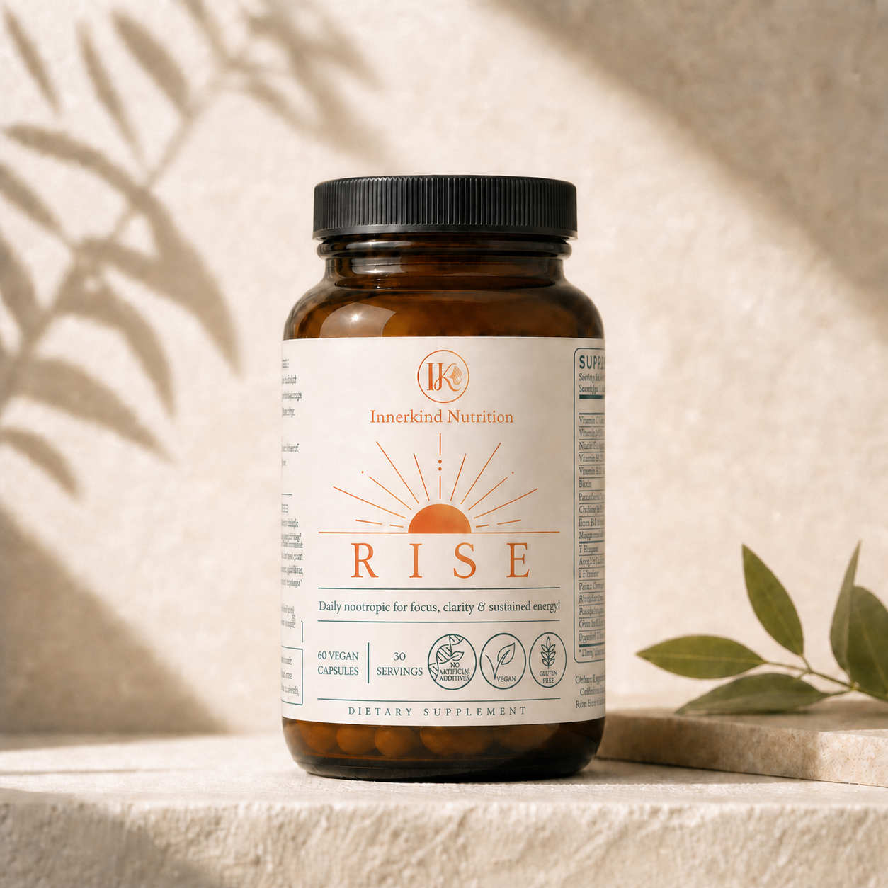 Innerkind Rise in its amber glass bottle with black metal cap